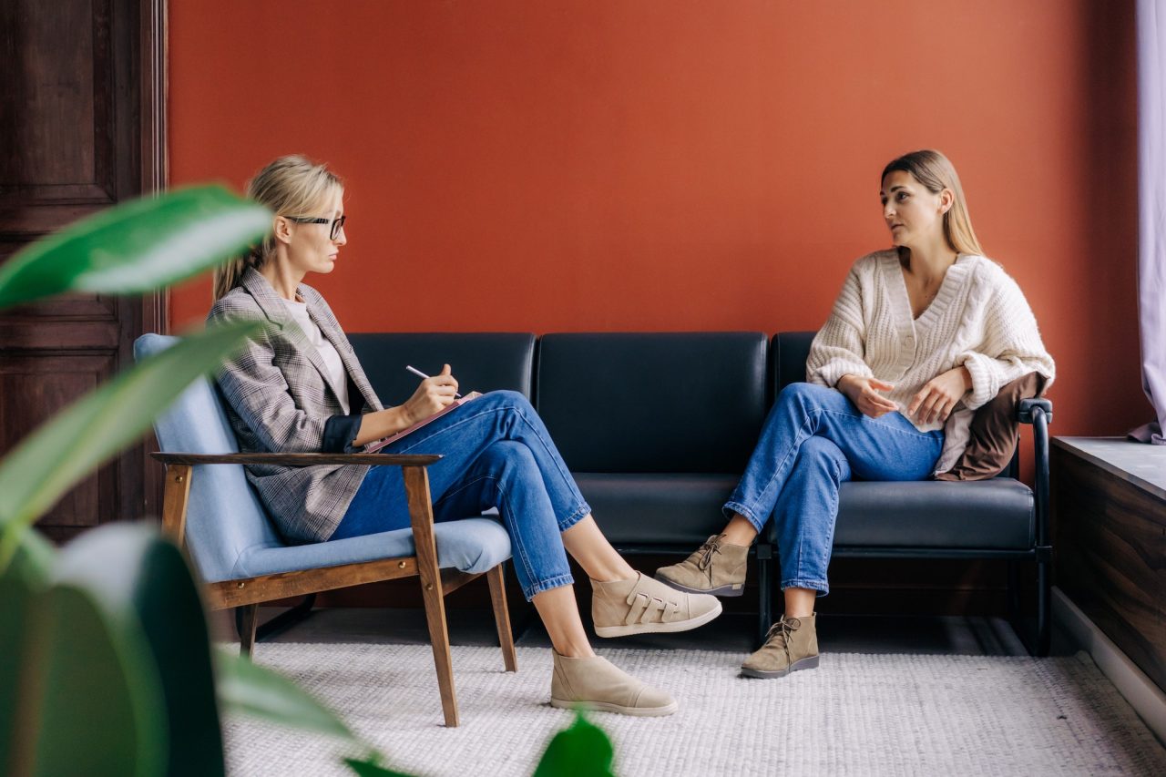 A therapist consulting with a patient during a session